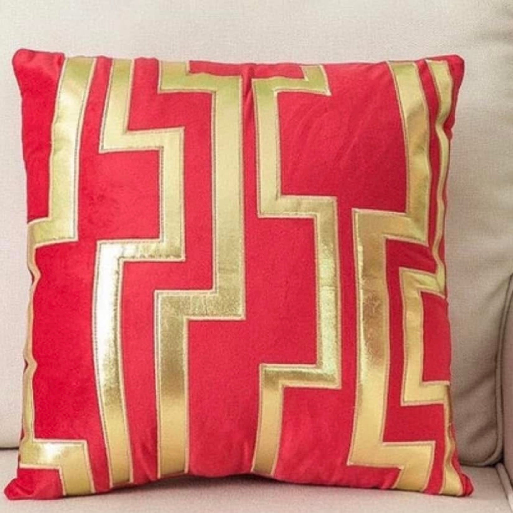 Front view of the Crimson Labyrinth cushion cover in bright red velvet with a metallic gold geometric maze pattern.