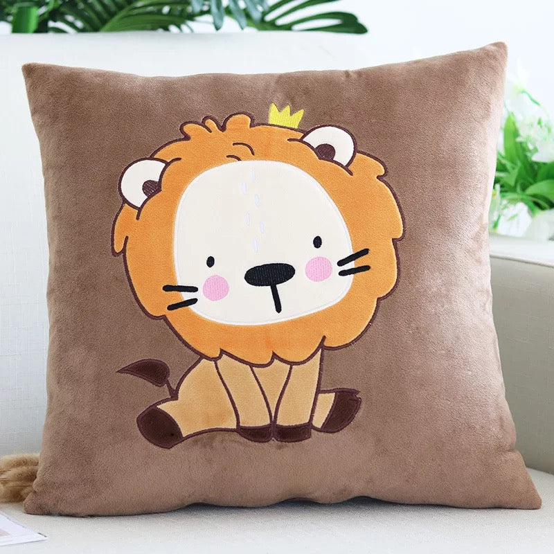 Close-up detail showing the high-quality embroidery of the lion cub face and yellow crown on the soft brown plush velvet fabric.